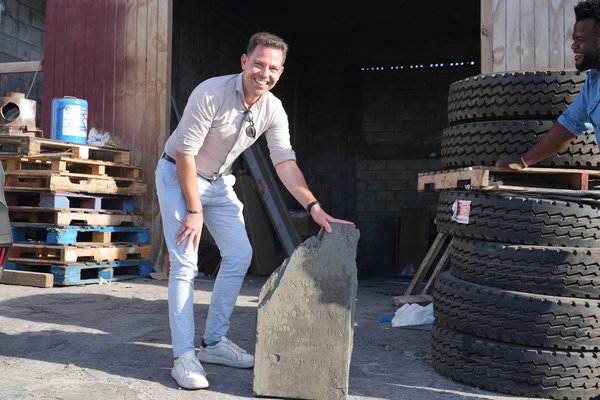Representative holding Statia Artefact